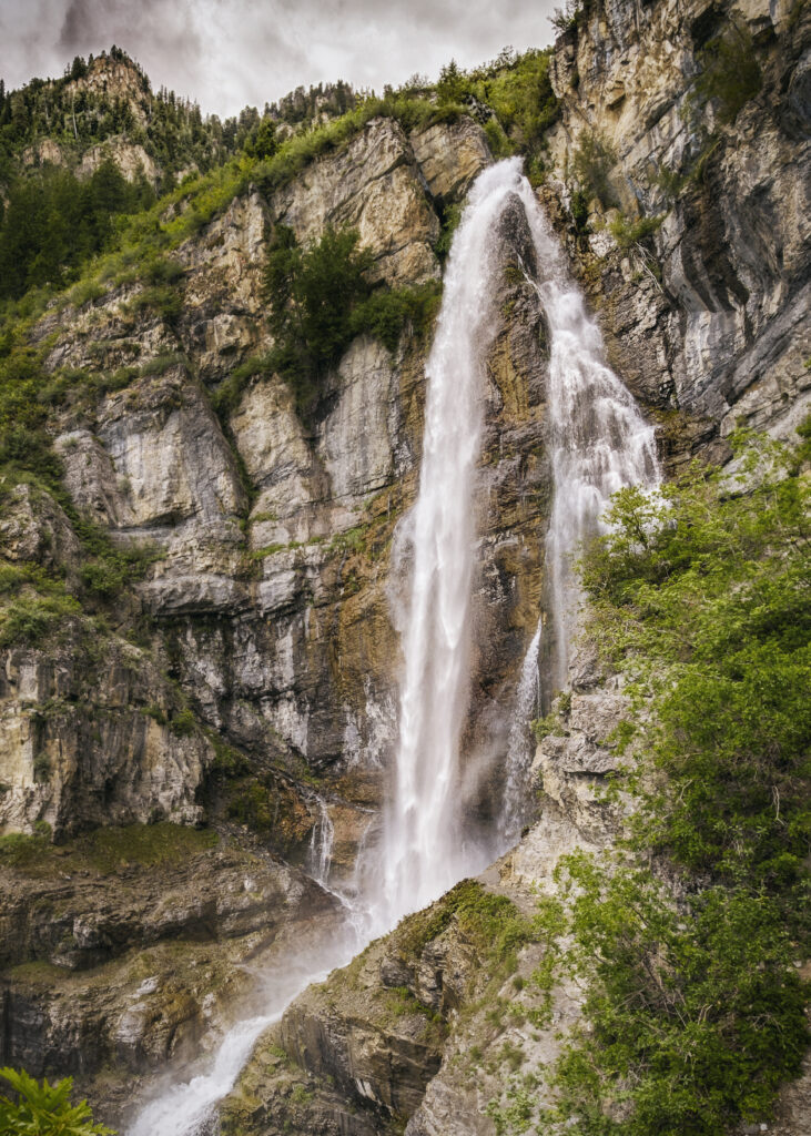 Waterfall in full bloom crashing down the mountain