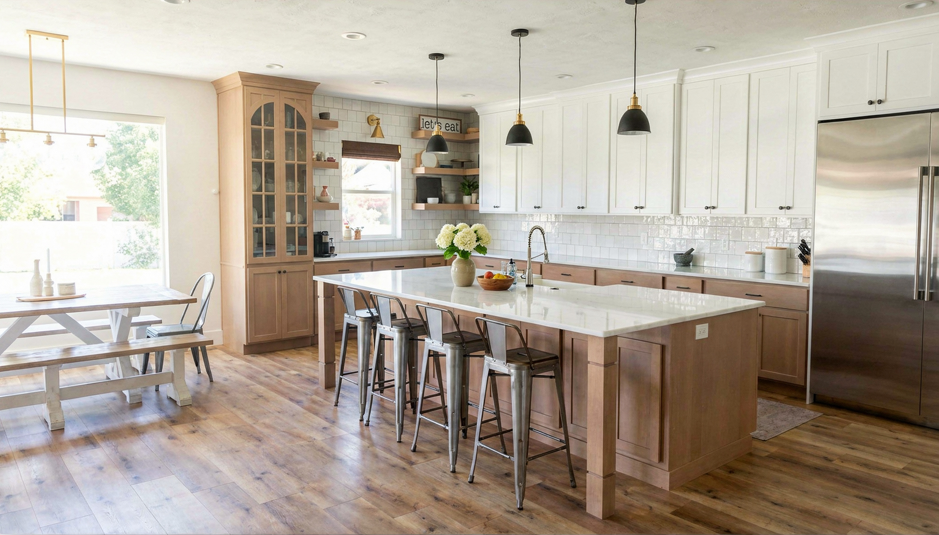 Warm, modern luxury kitchen with premium materials, spacious layout, and natural light designed by Roots Builders.
