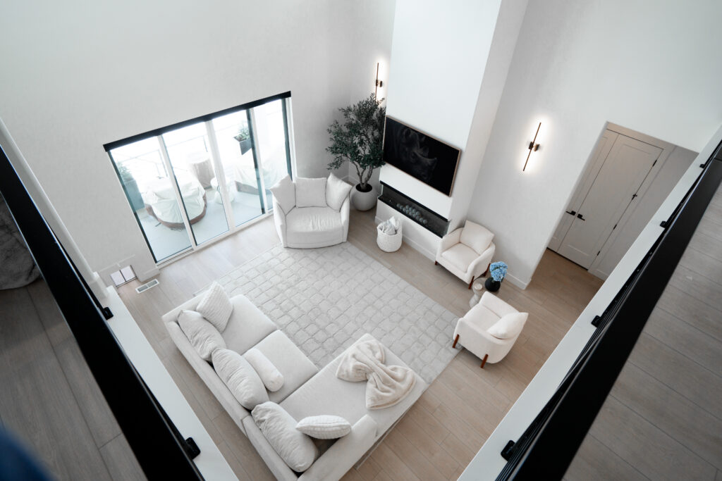 Modern white custom-built living room with natural light and elegant design