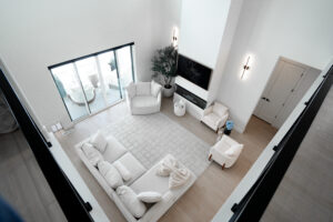 Modern white custom-built living room with natural light and elegant design