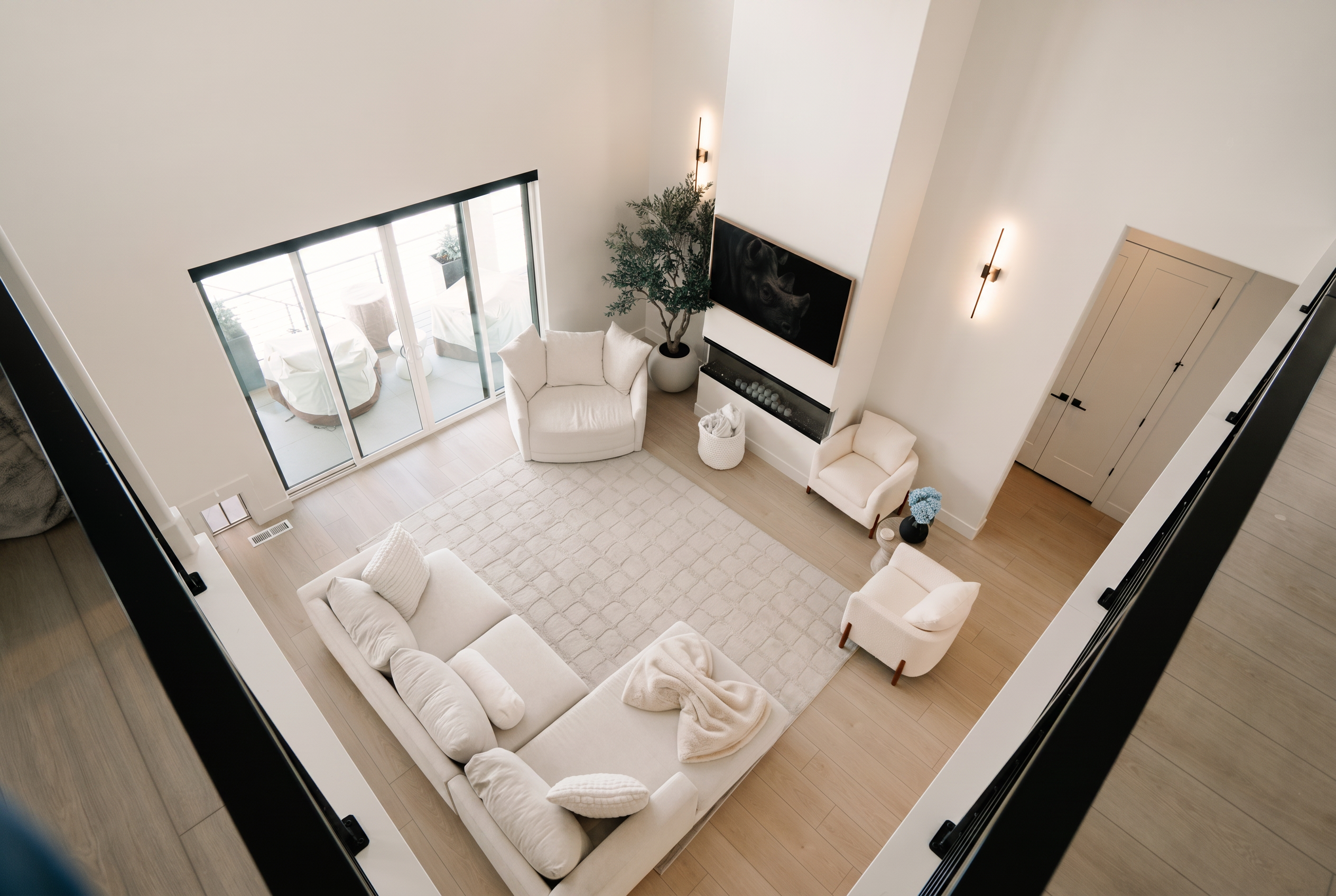 Modern white custom-built living room with natural light and elegant design