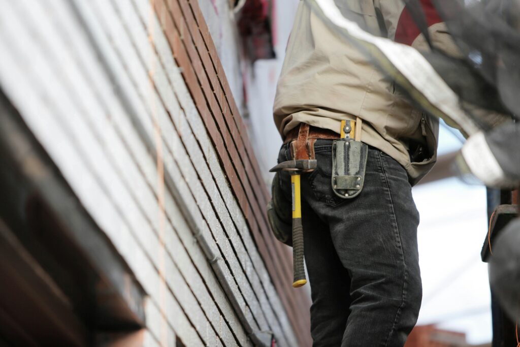 Construction worker building a custom home in Utah during spring