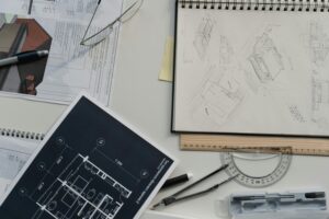 Architect reviewing blueprints for custom home design