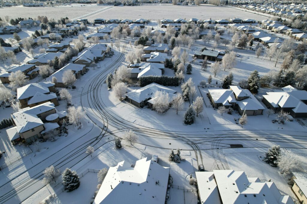 Aerial view of Utah residential neighborhood in winter showing established housing inventory and market conditions