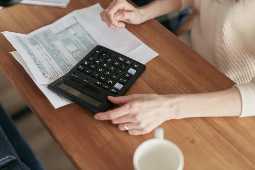 Someone calculating expenses.