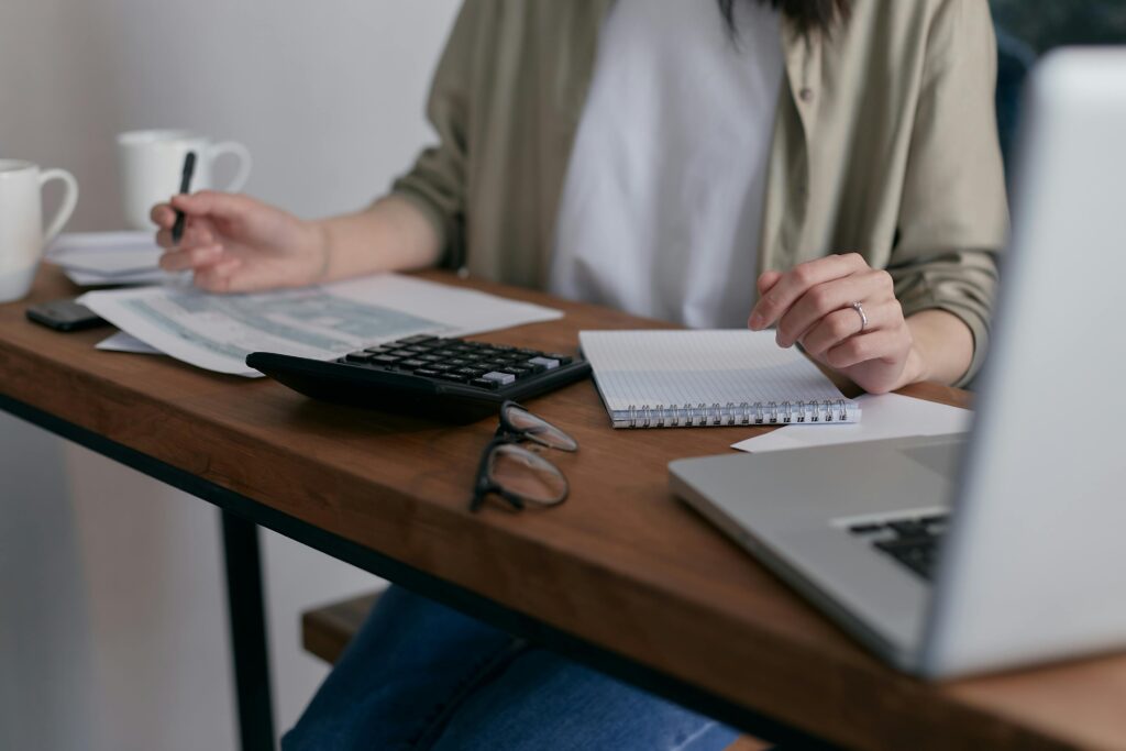 Someone calculating expenses for a home.