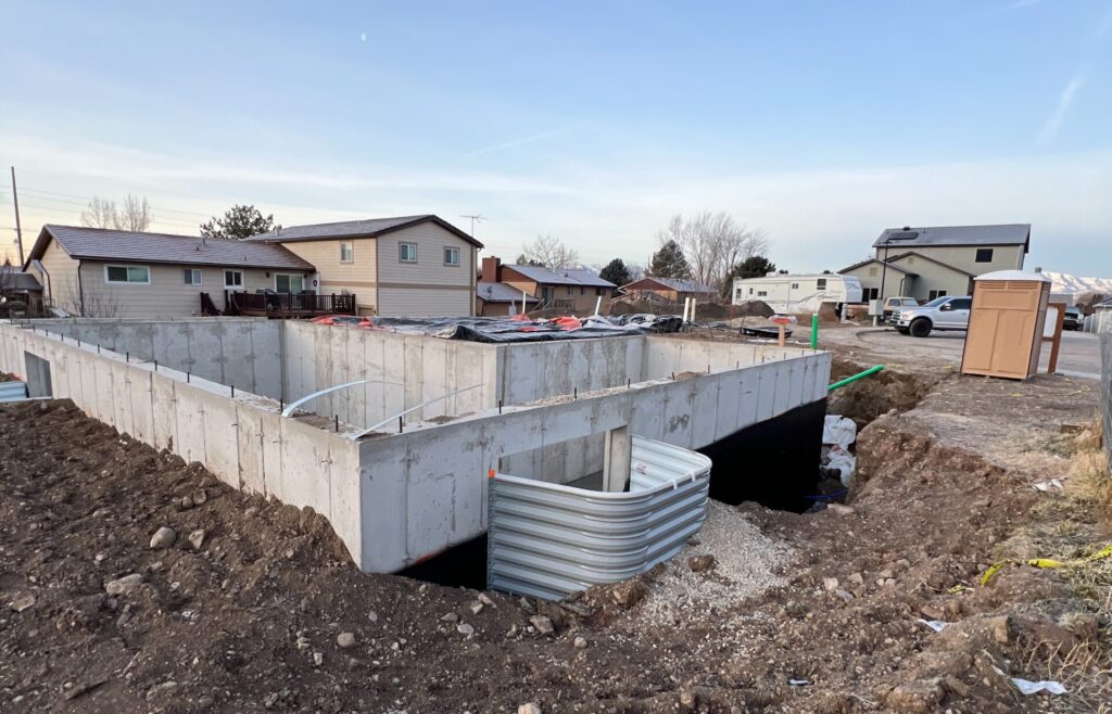 Foundation stage of a custom home project in Utah County, showing the first step of the Roots Builders process.