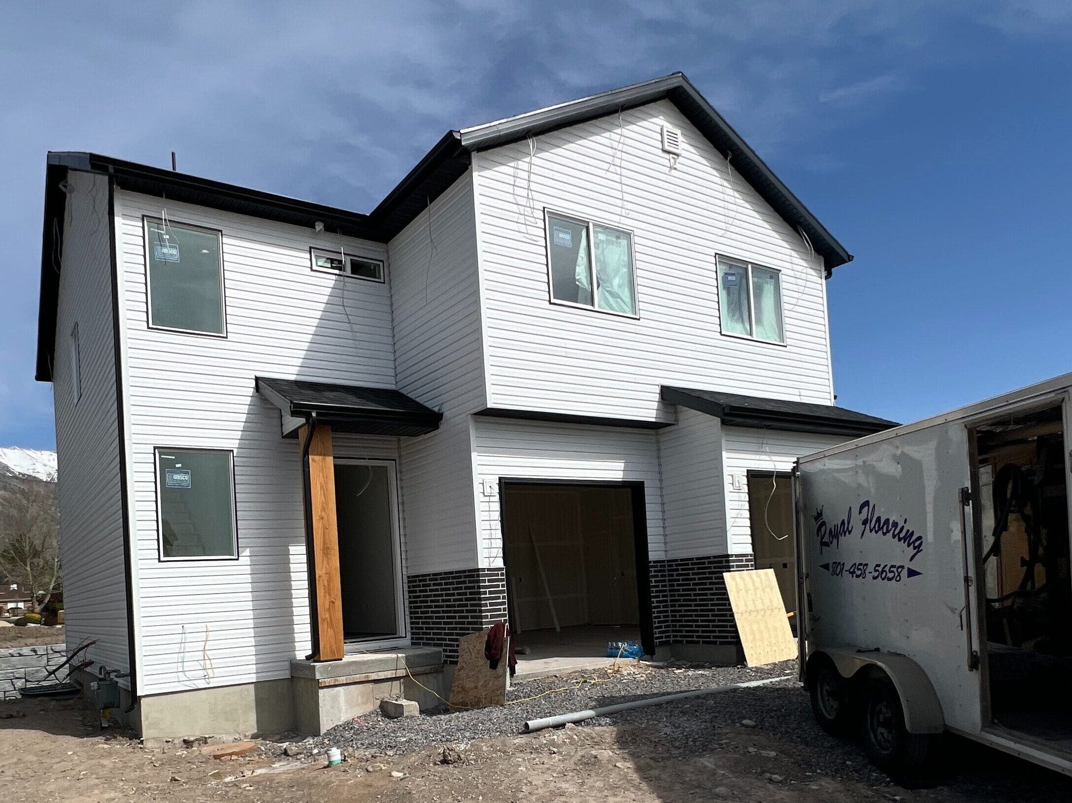 Two-story custom home in Utah County built by Roots Builders, showcasing modern design and craftsmanship.