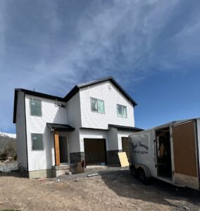 Two-story custom home in Utah County built by Roots Builders, showcasing modern design and craftsmanship.